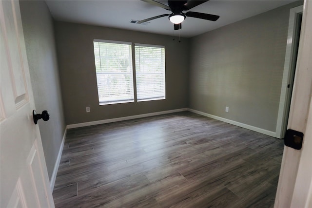 unfurnished room with dark hardwood / wood-style floors and ceiling fan