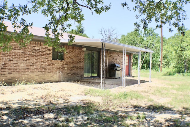 back of property with a patio