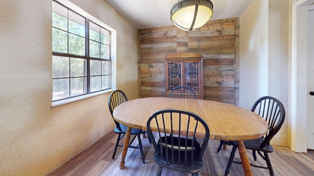 dining area with hardwood / wood-style floors