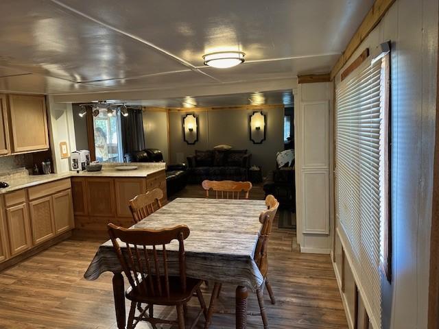 dining room with wood finished floors