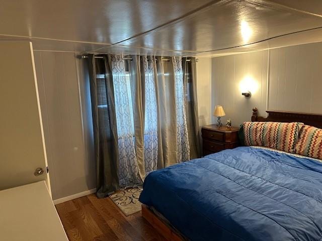 bedroom with wood finished floors