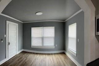 foyer with hardwood / wood-style floors and ornamental molding