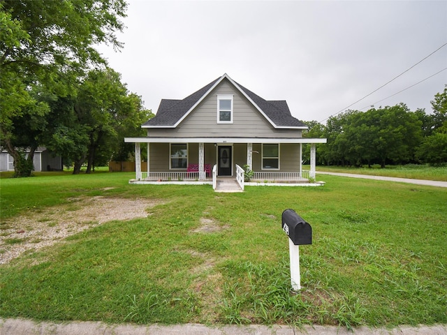 farmhouse-style home with a porch and a front lawn