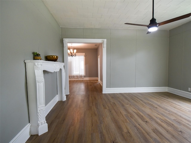 unfurnished dining area with wood-type flooring and ceiling fan with notable chandelier