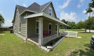 view of property exterior featuring a lawn