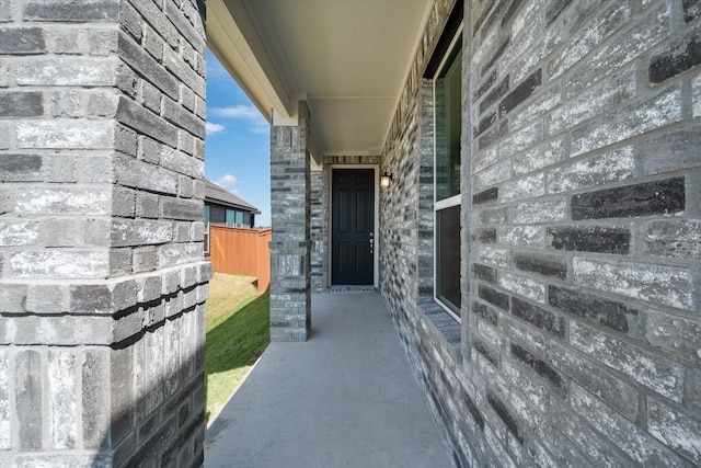 property entrance with stone siding