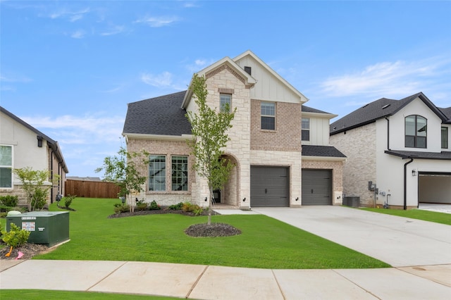 view of front of property with a garage, central air condition unit, and a front yard