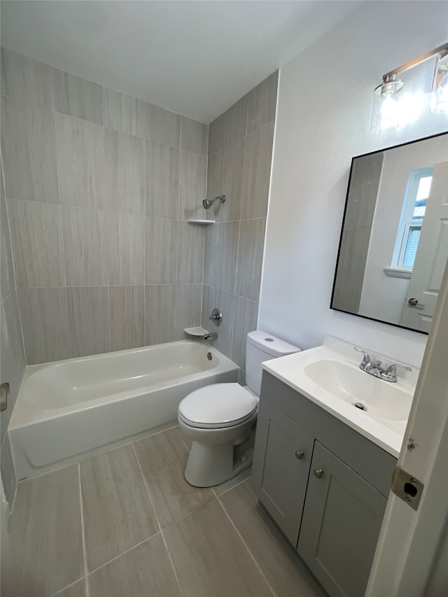 full bathroom with vanity, toilet, and tiled shower / bath