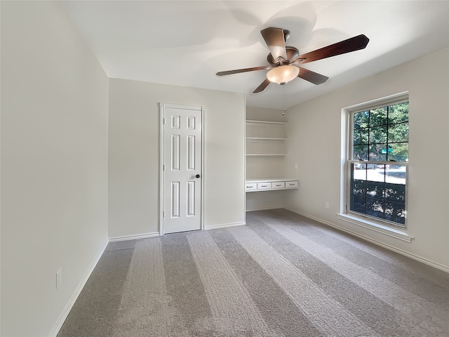 unfurnished bedroom featuring carpet flooring and ceiling fan