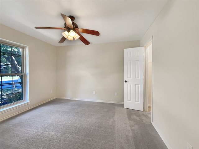 unfurnished room with carpet floors and ceiling fan