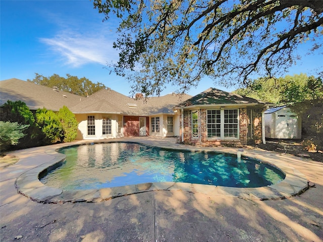 view of pool featuring a patio