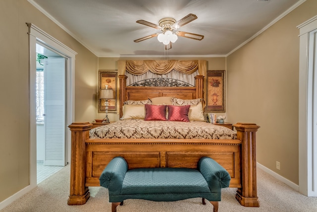 bedroom with light colored carpet, ceiling fan, and crown molding