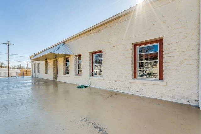 view of property exterior featuring a patio