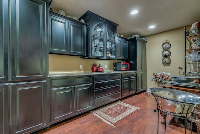 kitchen with dark hardwood / wood-style flooring