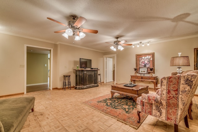 living room featuring a textured ceiling, ceiling fan, crown molding, and rail lighting