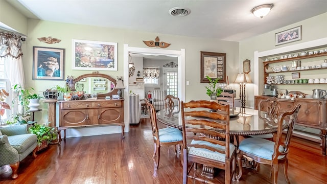 dining room with dark hardwood / wood-style floors