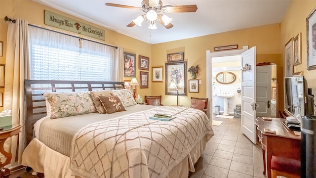 tiled bedroom featuring ceiling fan