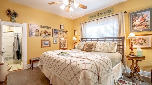 tiled bedroom featuring ceiling fan and a closet