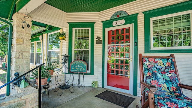 doorway to property featuring a porch