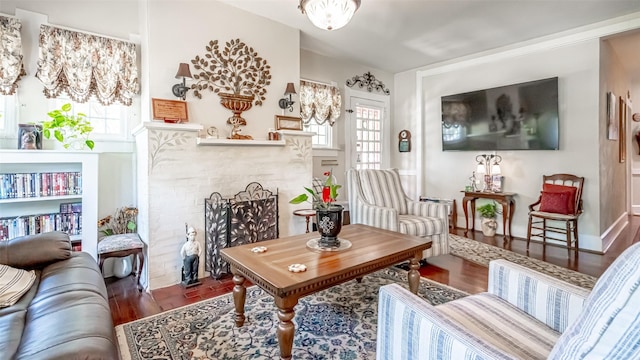 sitting room with dark wood-type flooring