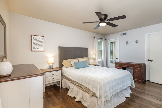 bedroom featuring dark hardwood / wood-style floors and ceiling fan