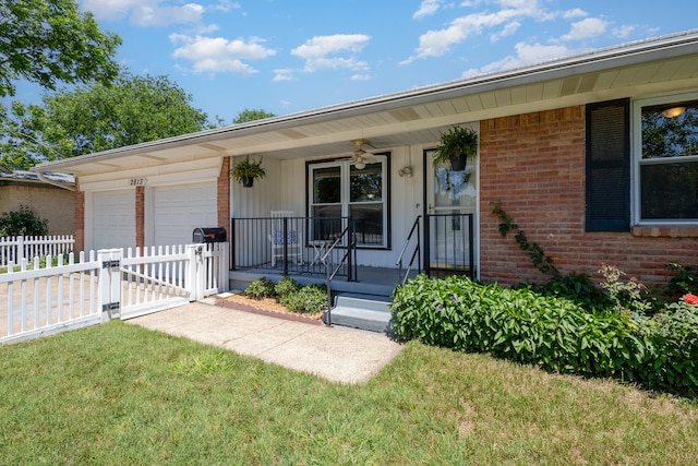 ranch-style house featuring a front lawn, a garage, and a porch