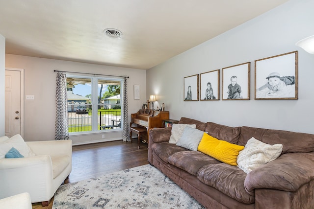 living room featuring dark wood-type flooring