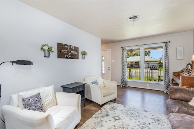 living room with dark hardwood / wood-style flooring