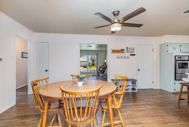 dining space featuring ceiling fan and dark hardwood / wood-style flooring