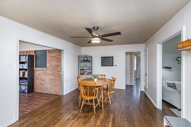 dining space featuring dark hardwood / wood-style floors and ceiling fan