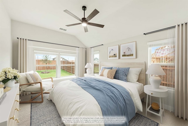 bedroom featuring lofted ceiling, ceiling fan, and light colored carpet