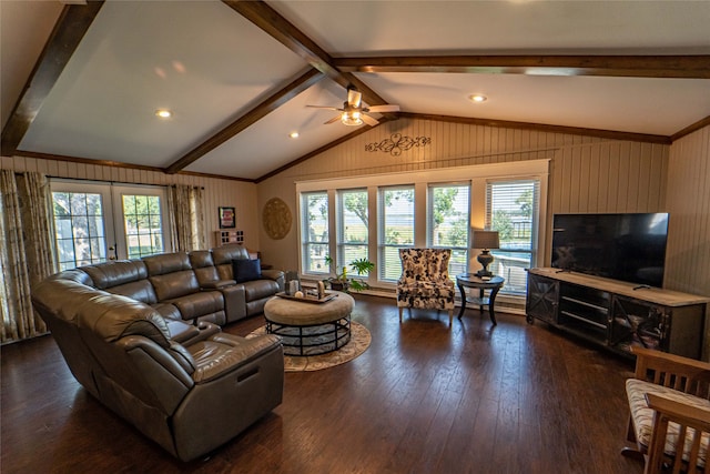 living room featuring a healthy amount of sunlight, vaulted ceiling with beams, ceiling fan, and dark wood-type flooring