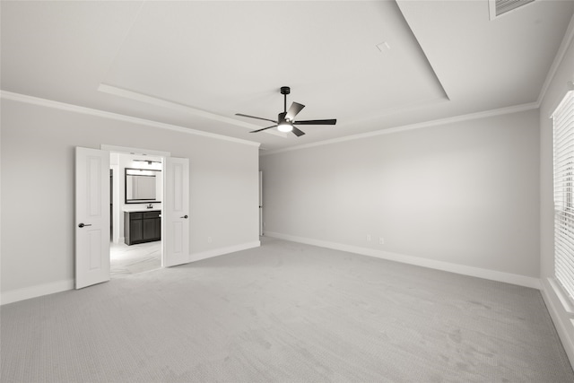 unfurnished room featuring crown molding, light colored carpet, and ceiling fan