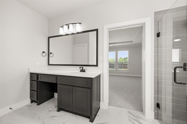 bathroom with vanity and a shower with shower door