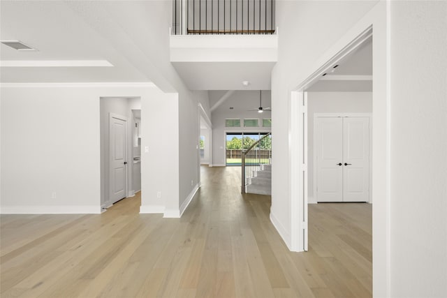 entryway featuring light wood-type flooring and ceiling fan