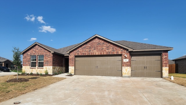 ranch-style home featuring a garage