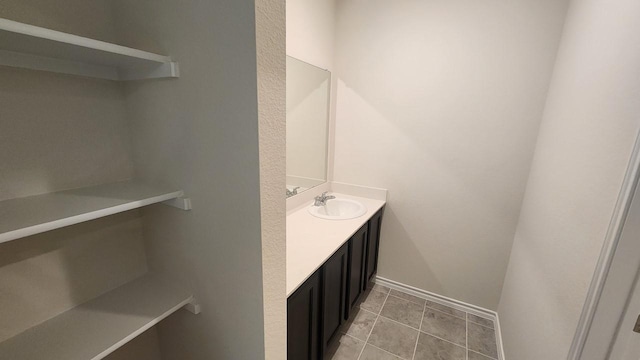 bathroom with vanity and tile patterned floors