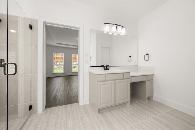 bathroom featuring vanity, hardwood / wood-style flooring, and a shower with shower door