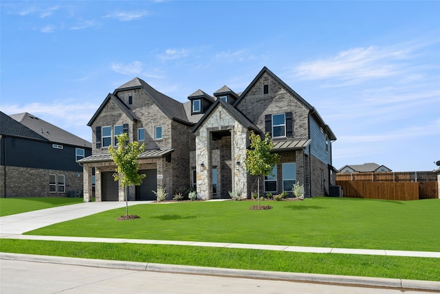 view of front of home featuring a front yard and a garage