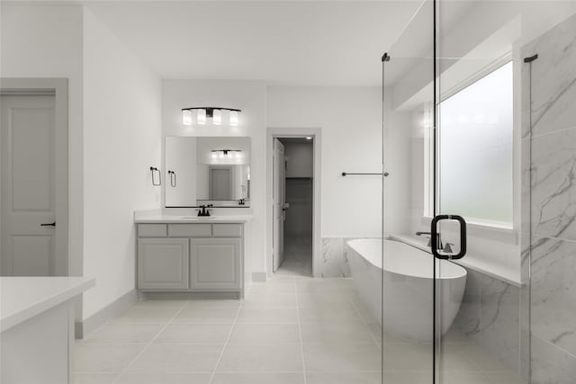 bathroom featuring independent shower and bath, tile patterned flooring, vanity, and a wealth of natural light