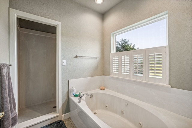 bathroom featuring a healthy amount of sunlight and a shower