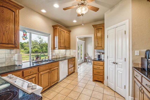 kitchen with sink, tasteful backsplash, and dishwasher