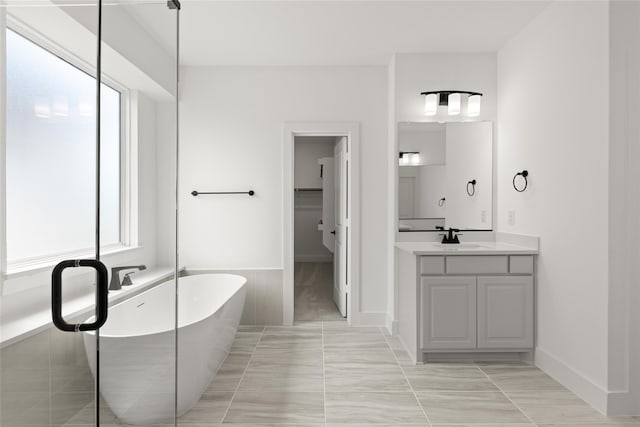 bathroom with vanity and a bathtub