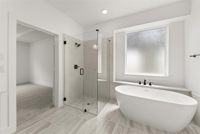 bathroom with plus walk in shower and tile patterned floors