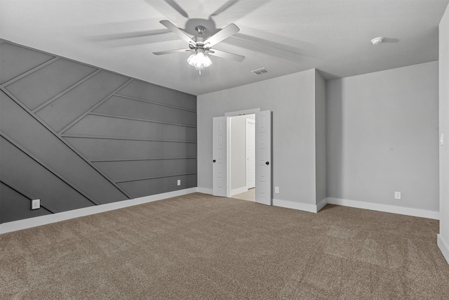 unfurnished bedroom featuring ceiling fan and carpet floors