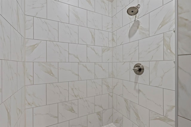 bathroom featuring tiled shower