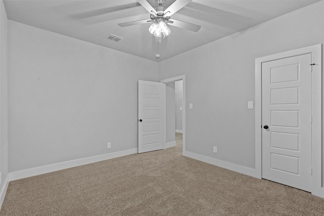 carpeted empty room with ceiling fan