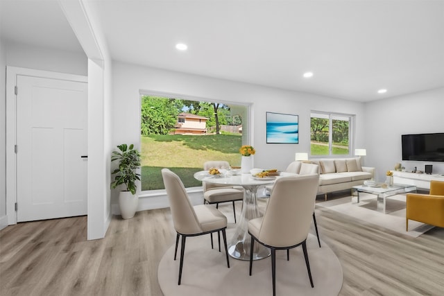 dining area with light hardwood / wood-style flooring