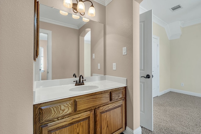 bathroom featuring crown molding and vanity