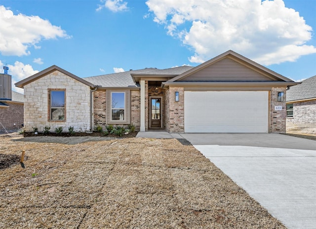 view of front of house with driveway, an attached garage, roof with shingles, and brick siding